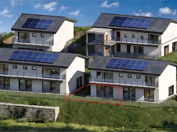 Moderno 2.5 locali con giardino privato, vista aperta e parcheggio incluso